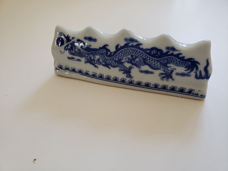 Blue and White Porcelain Brush Rest with Dragon Pattern: Essential Tool for Traditional Artistry