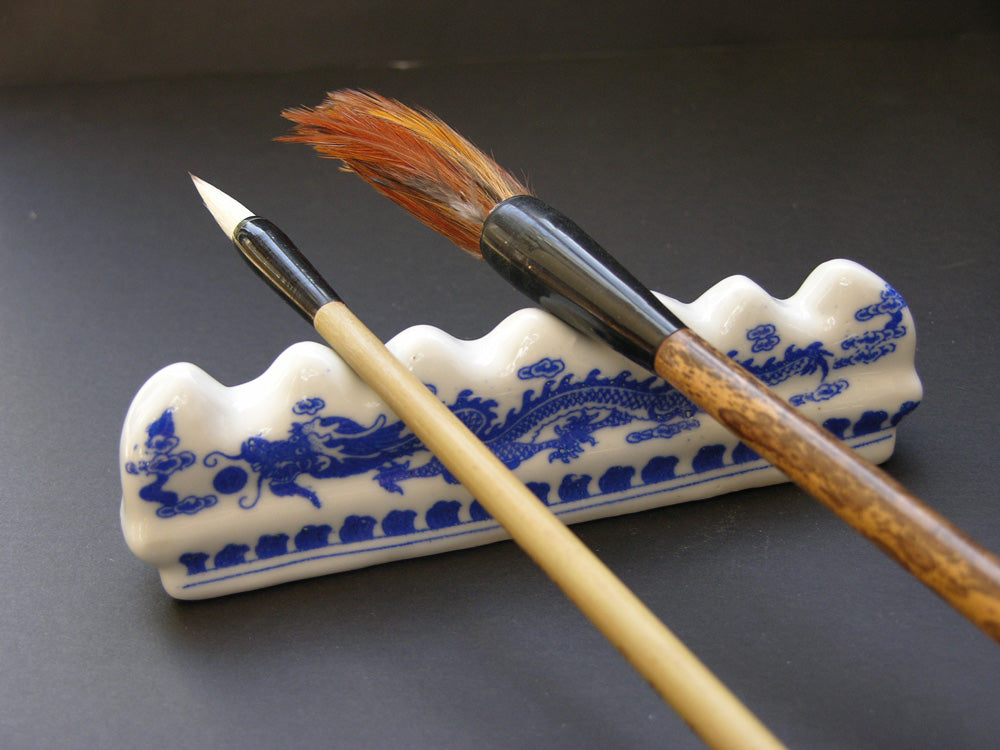 Blue and White Porcelain Brush Rest with Dragon Pattern: Essential Tool for Traditional Artistry